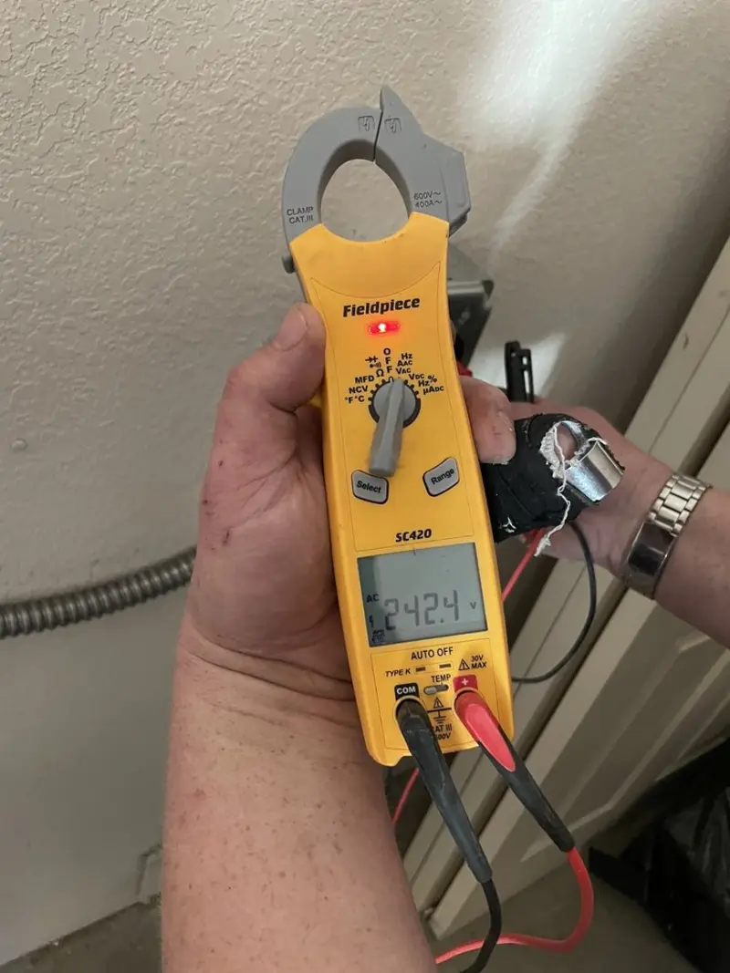 Voltage testing with clamp meter during Recessed Lighting Installation in Ingleside
